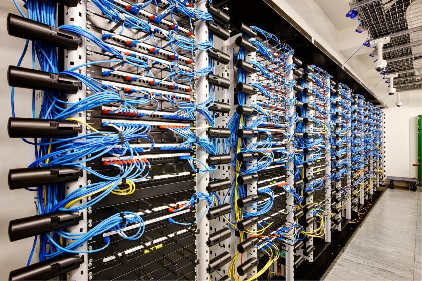 wall of network cabling blue bank computer room