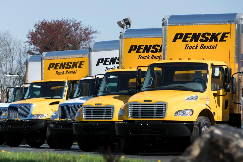 A logo sign and rental trucks outside of a facility occupied by Penske Truck Leasing in Reading, Pennsylvania, on April 22, 2018.
