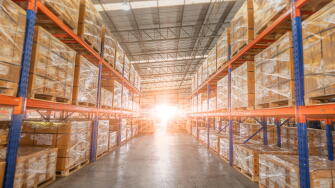 Full of goods stock in warehouse industrial and logistics background. Commercial Storage area. Large products distribution Inventory cargo shelves.