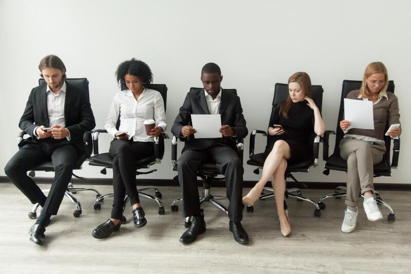 Nervous stressed job applicants preparing for interview waiting 