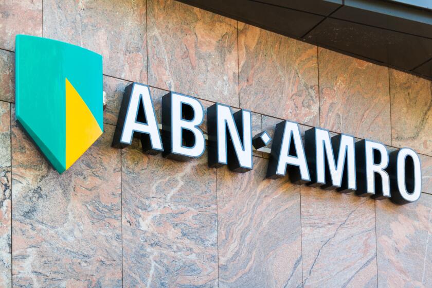 Brand name logo ABN AMRO bank on local branch office in Alkmaar, North Holland,  Netherlands