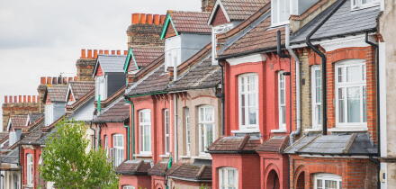 Row of English traditional terraced houses in Crouch End, North London, UK