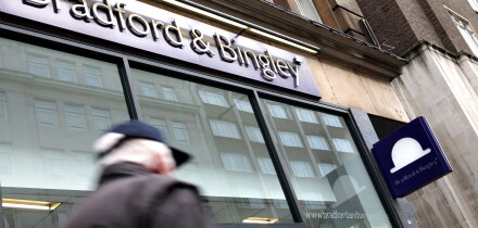 Commuters pass by a branch of Bradford & Bingley in central London, United Kingdom in 2009.