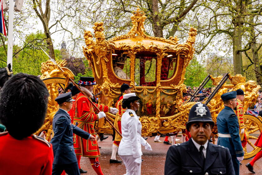 King Charles III and Queen Camilla Travel Back To Buckingham Palace In The Gold State Coach As Part Of The Coronation Procession, London, UK.