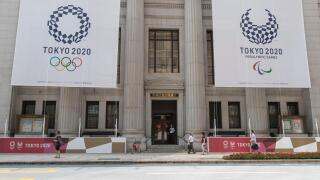Tokyo, Japan. 25th July, 2019. Huge banners of Tokyo 2020 Olympic Games are on display outside Sumitomo Mitsui Trust Bank to promote the 2020 Tokyo Olympic and Paralympic Games. Tokyo marks one year to go 2020 Olympics decorating with Olympic emblems and 