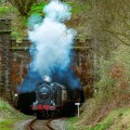 LMS 0-6-0 4F locomotive seen steaming from the Nuttall Park tunnel on the East Lancashire heritage railway towards Ramsbottom.