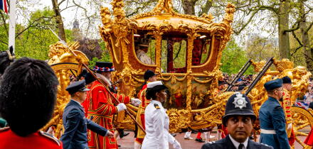 King Charles III and Queen Camilla Travel Back To Buckingham Palace In The Gold State Coach As Part Of The Coronation Procession, London, UK.