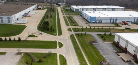 Aerial view of industrial warehouses and parking