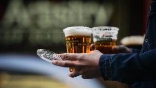 A person walks with a take away beers on St. Patrick's Day as public events in Ireland were cancelled due to Level 5 Covid-19 lockdown. On Wednesday, 17 March 2021, in Dublin, Ireland. (Photo by Artur Widak/NurPhoto)