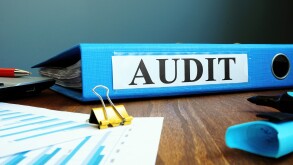 Folder with internal company audit report-adobe