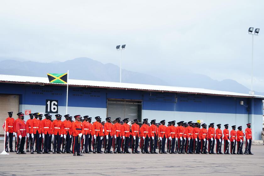 Members of the military await the arrival of The Duke and Duchess of Cambridge at Norman Manley International Airport in Kingston, Jamaica, on day four of their tour of the Caribbean on behalf of the Queen to mark her Platinum Jubilee. Picture date: Tuesd