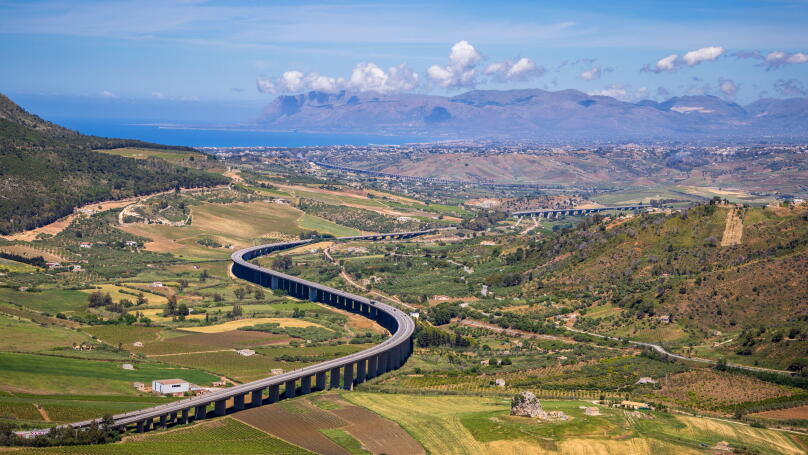 The Autostrade as it winds its way along the North Sicilian coast from the Greek Theater at Segesta, Sicily