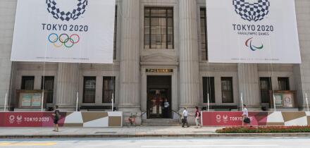 Tokyo, Japan. 25th July, 2019. Huge banners of Tokyo 2020 Olympic Games are on display outside Sumitomo Mitsui Trust Bank to promote the 2020 Tokyo Olympic and Paralympic Games. Tokyo marks one year to go 2020 Olympics decorating with Olympic emblems and 