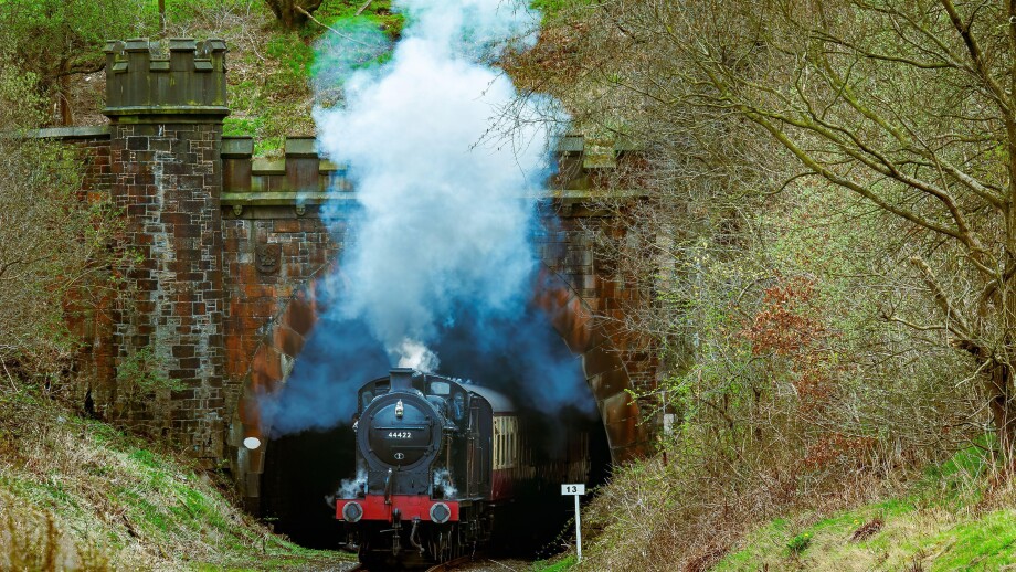 LMS 0-6-0 4F locomotive seen steaming from the Nuttall Park tunnel on the East Lancashire heritage railway towards Ramsbottom.