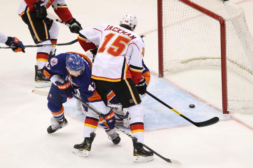 Dec. 29, 2011 - Uniondale, New York, UNITED STATES - Calgary Flames right wing TIM JACKMAN(15) scores a goal against the New York Islanders in the first period at Nassau Veterans Memorial Coliseum. (Credit Image: © Debby Wong/Southcreek/ZUMAPRESS.com)
