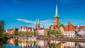 Historic skyline along the Trave river in the old town of Lubeck, Germany on a summer day
