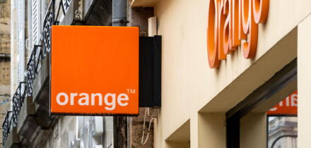 Orange shop sign in Bayonne, France
