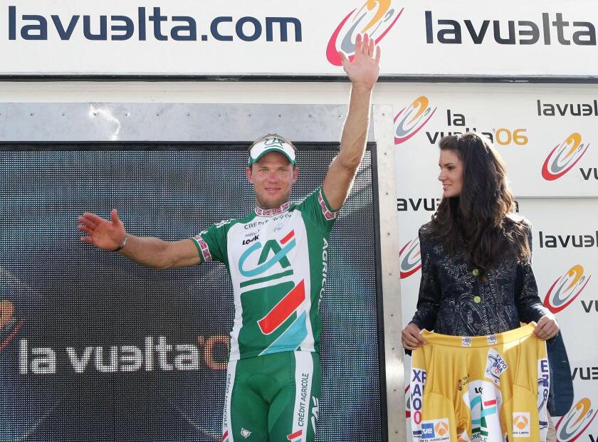 Norway cyclist Thor Hushovd of the Credit Agricole team celebrates his yellow jersey on the podium after the fourth stage of the Spanish Vuelta from Almendralejo to Caceres, southern Spain, Tuesday, Aug. 29, 2006. German rider Erik Zabel of the Team Milra