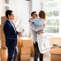 Real Estate Agent And Happy Couple Moving Into New Home