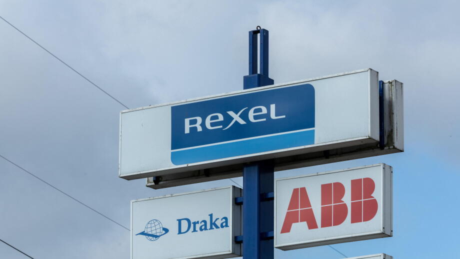 REXEL sign logo at a store. Rexel is the electrical wholesaler with electrical products for residential construction, industry, utilities.