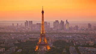 Paris skyline at sunset showing the Eiffel tower and surrounding areas Paris France EU Europe