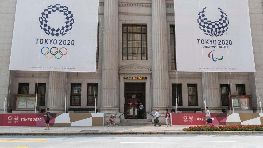 Tokyo, Japan. 25th July, 2019. Huge banners of Tokyo 2020 Olympic Games are on display outside Sumitomo Mitsui Trust Bank to promote the 2020 Tokyo Olympic and Paralympic Games. Tokyo marks one year to go 2020 Olympics decorating with Olympic emblems and 