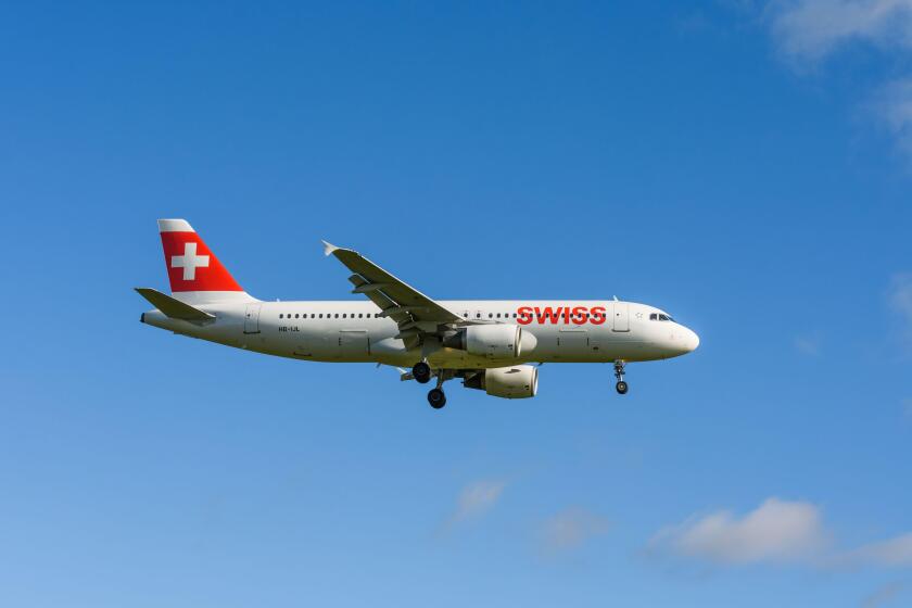 Plane Airbus A320-214 of Swiss International Air Lines on approach to landing at Zurich Airport