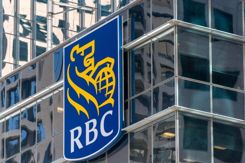Business logo or sign of the Royal Bank of Canada (RBC) in a skyscraper by the city waterfront in Toronto, Canada