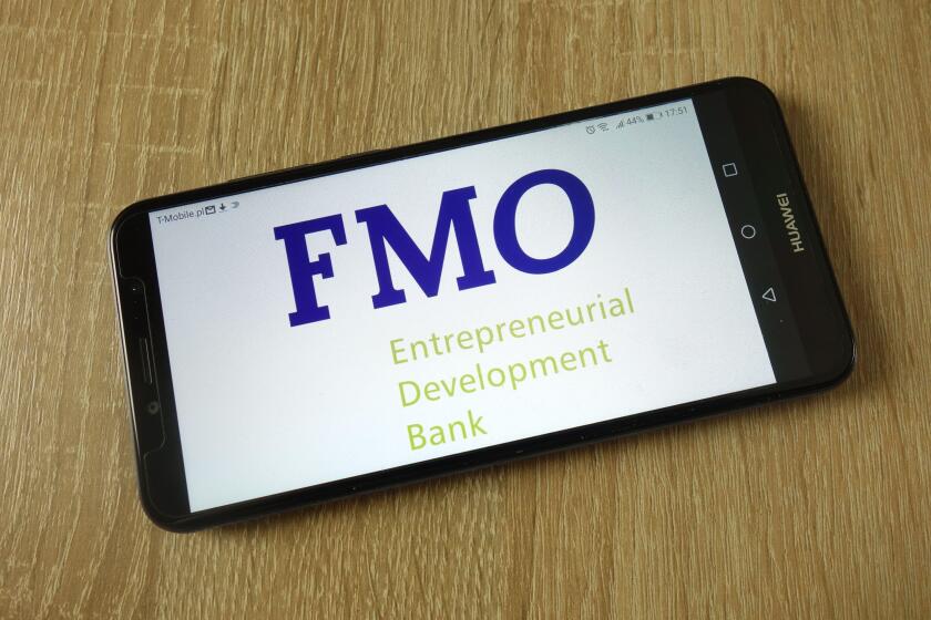 Netherlands Development Finance Company (FMO) logo displayed on smartphone
