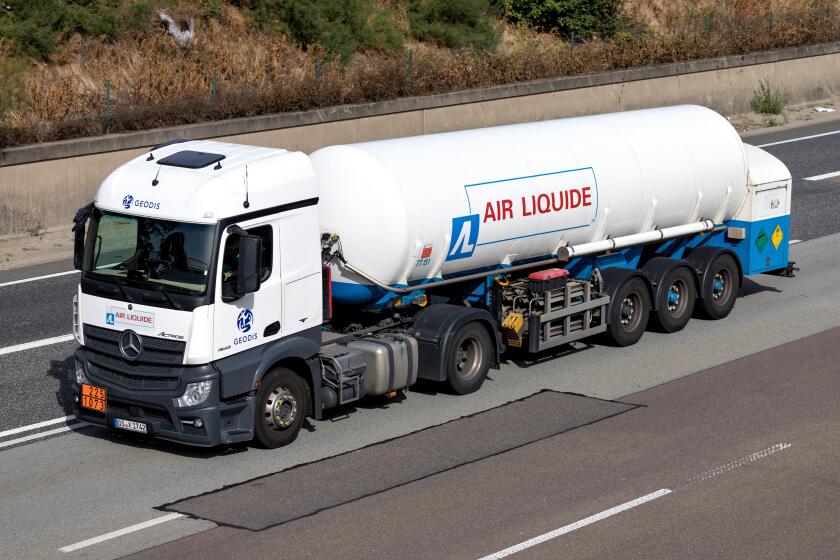 Air Liquide truck on motorway. Air Liquide is a French multinational company which supplies industrial gases and services to various industries.