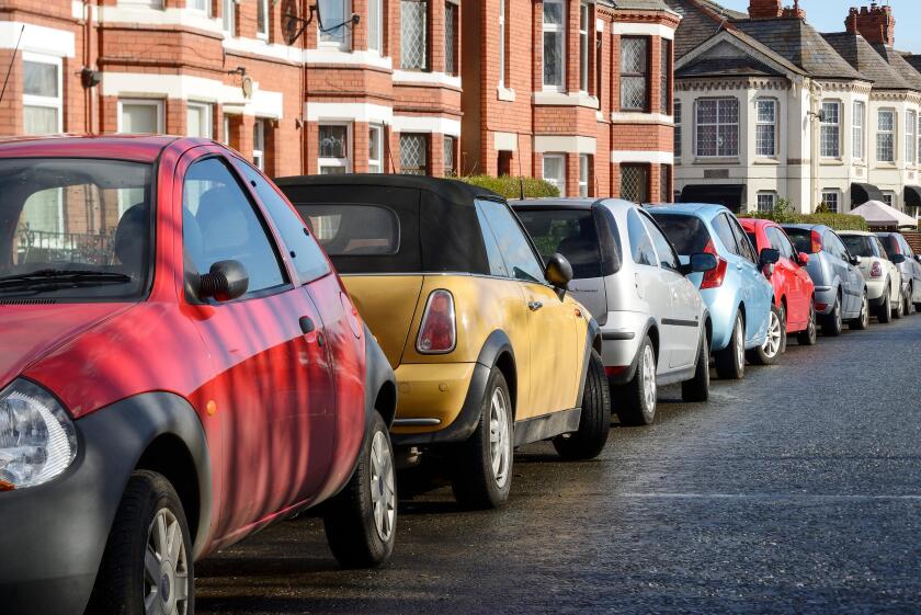 Cars parked on the side of a road