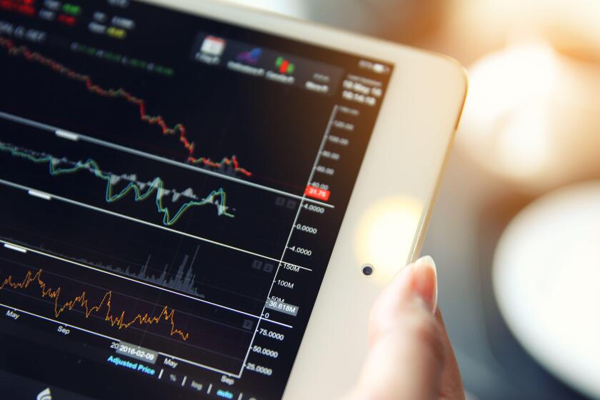trading online on tablet with bussiness woman hand