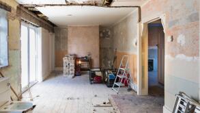 Home DIY renovation gutted empty house interior bare walls