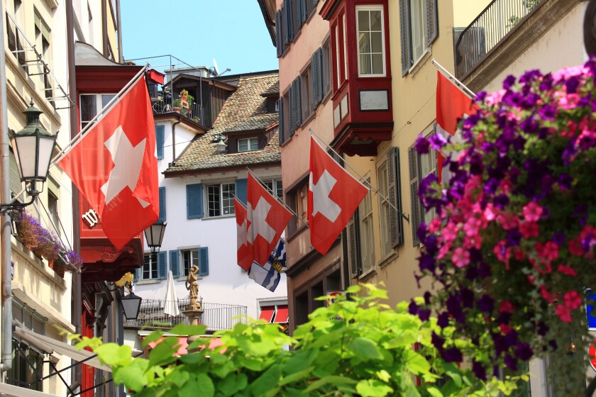 Switzerland, Zurich, old city, street and flag.