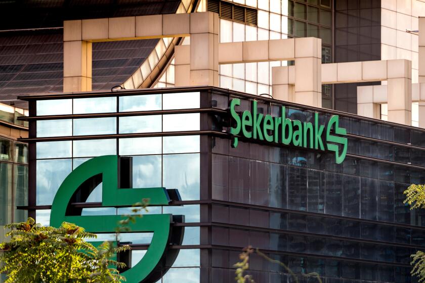 Close up of the logo and banner of public owned enterprise Sekerbank at Istanbul headquarters in Levent, Istanbul, Turkey.