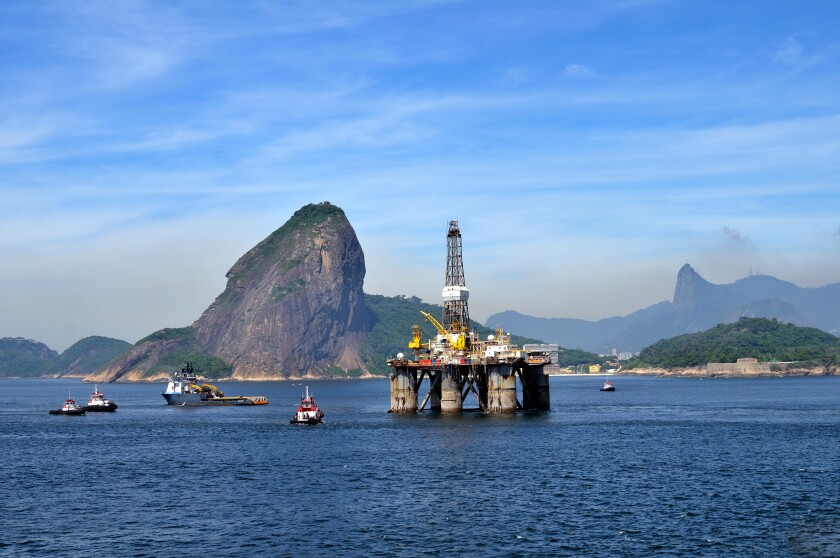 Oil rig of the Brazilian oil company Petrobras passing Sugarloaf Mountain, Bahia de Guanabara Bay, Rio de Janeiro, Brazil