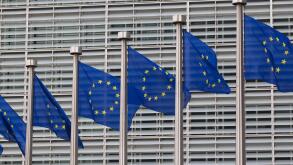 European flags in front of the Berlaymont building, headquarters of the European commission in Brussels, Belgium