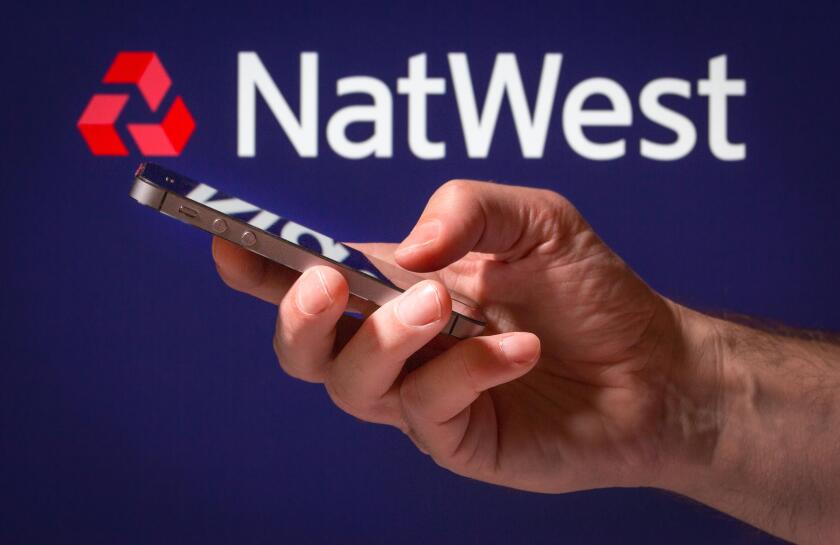 A man using Natwest online banking on his mobile phone
