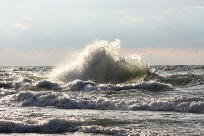 Large wave breaking on beach in New Buffalo Michigan