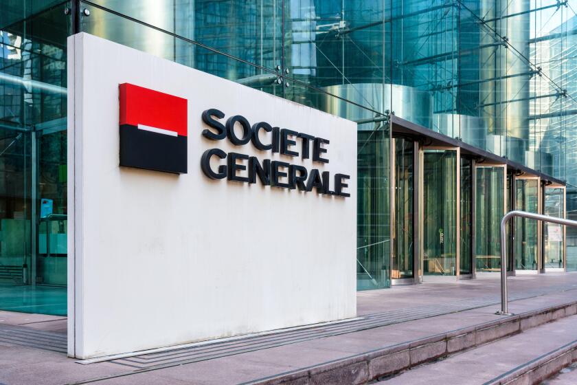 Sign of the Societe Generale at the entrance of the head office of the french banking group in La Defense business district.