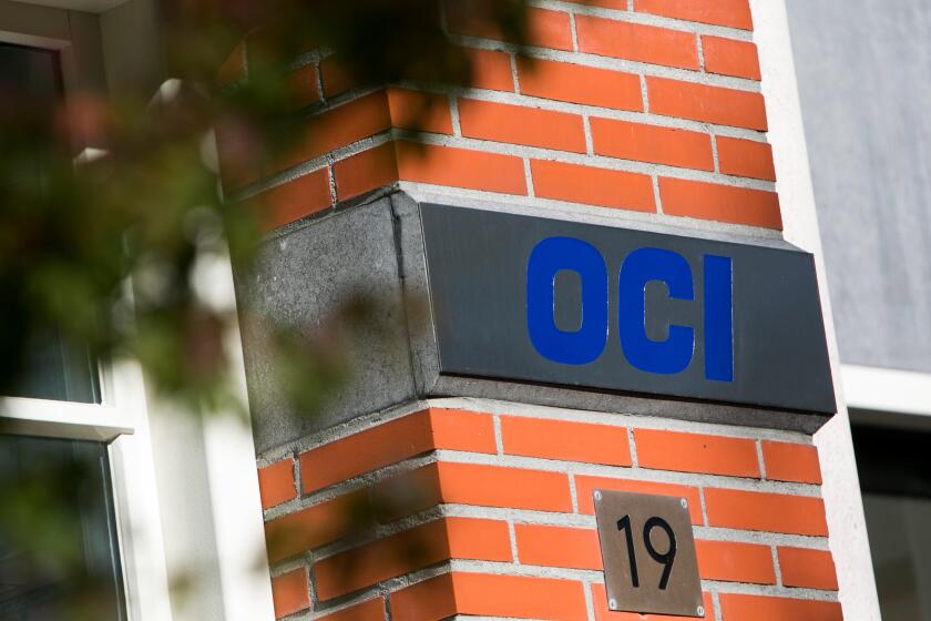 A logo sign outside of the headquarters of OCI N.V. in Amsterdam, Netherlands on October 2, 2015.