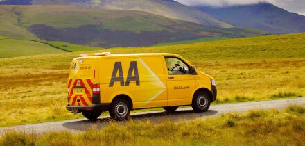 AA van on rural road. Aughertree Fell, Uldale, The Lake District National Park, Cumbria, England, United Kingdom, Europe.