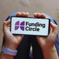 In this photo illustration, the Funding Circle logo is displayed on a smartphone screen