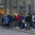 Shopping street Limbecker Strasse, long queues in front of some shops, here a fashion chain, pedestrian zone, full, many people shopping, some with ma