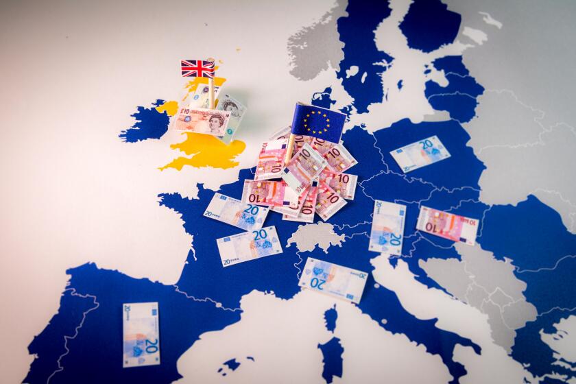 EU and UK flags,euro and pound bills on a european map with EU members in blue.Suitable for a concept of BREXIT,pound against euro,London or Frankfurt