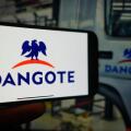 Roosendaal, The Netherlands - March 1, 2025: A mobile phone displaying the logo of Dangote Group, with the company website in the background.