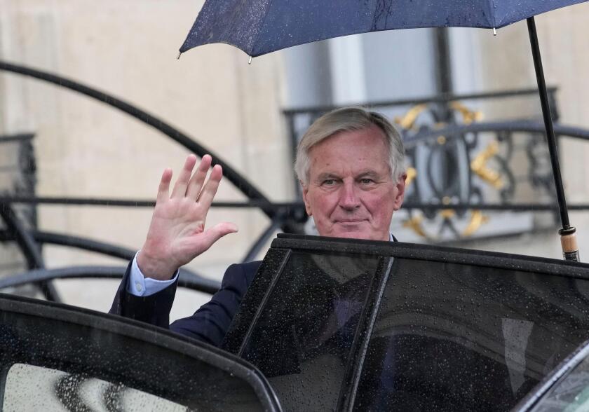 French Prime Minister Michel Barnier boards a car after the first weekly cabinet meeting at the Elysee Palace Monday, Sept. 23, 2024 in Paris. (AP Photo/Christophe Ena)