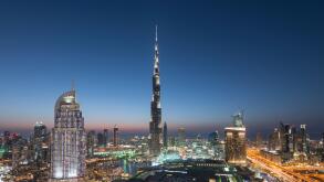 Burj Khalifa , the Dubai Mall and skyline of Downtown Dubai at night in United Arab Emirates