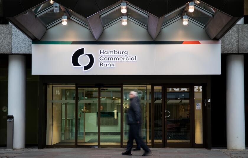 04 February 2019, Hamburg: Passers-by pass by the main entrance of the Hamburg Commercial Bank headquarters. Two months after the privatisation, HSH Nordbank now officially bears the new name Hamburg Commercial Bank. The change of name to a private commer