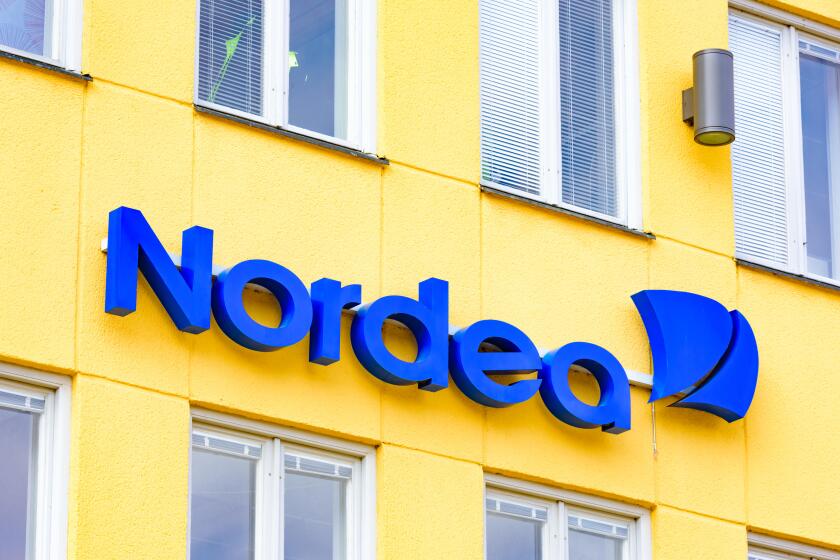Kristianstad, Sweden - March 20, 2016: Nordea is one of the major banks in Sweden. Here is their logo found as a sign above a ba